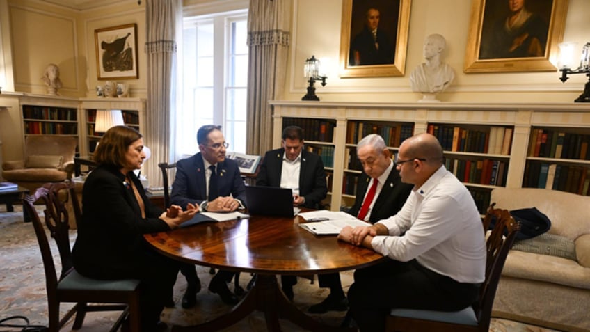 Israeli Prime Minister Benjamin Netanyahu with advisers ahead of his meeting with President Donald Trump on Tuesday, February 4, 2025.