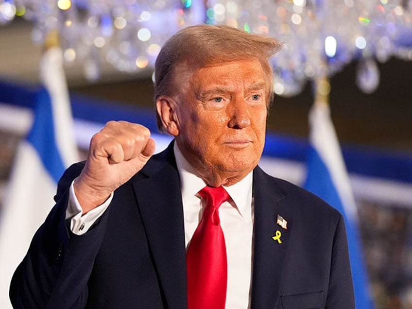 Republican presidential nominee former President Donald Trump gestures after speaking at a