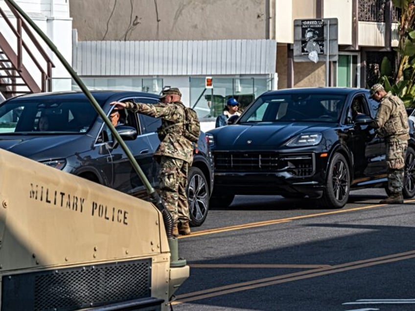 National Guard diverting pedestrians and cyclists from entering Pacific Palisades and Paci