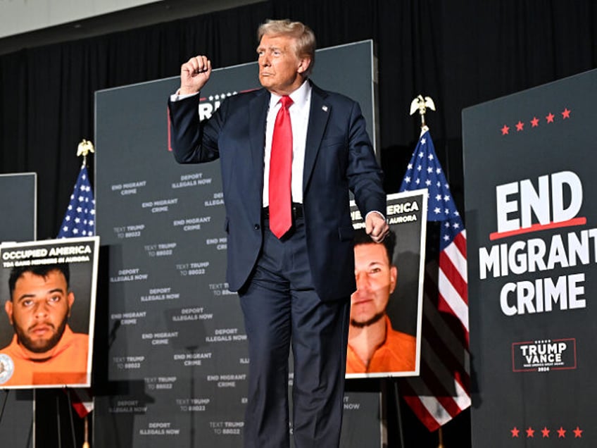 AURORA, COLORADO - OCTOBER 11: Former President Donald J. Trump dances on stage during a c