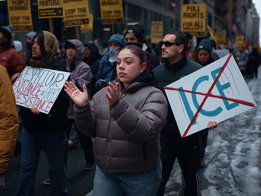 Protestors take to the streets and march during a pro-migrant rally, demanding an end to d