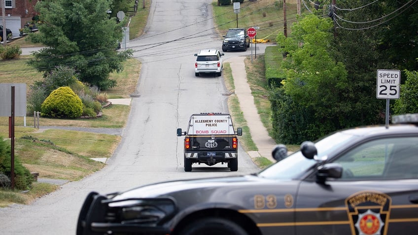 An Allegheny County Police Bomb Squad car drives towards the home of Thomas Matthew Crooks