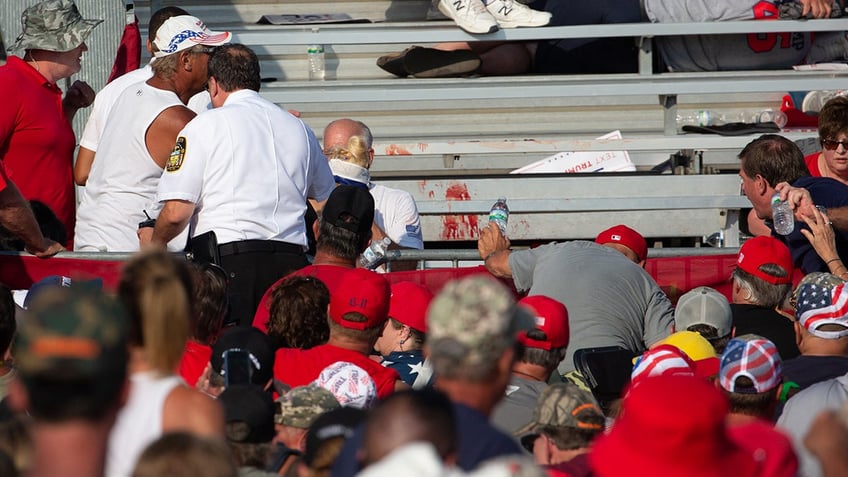 Blood is seen in the stands after guns were fired at Republican candidate Donald Trump at a campaign event at Butler Farm Show Inc.