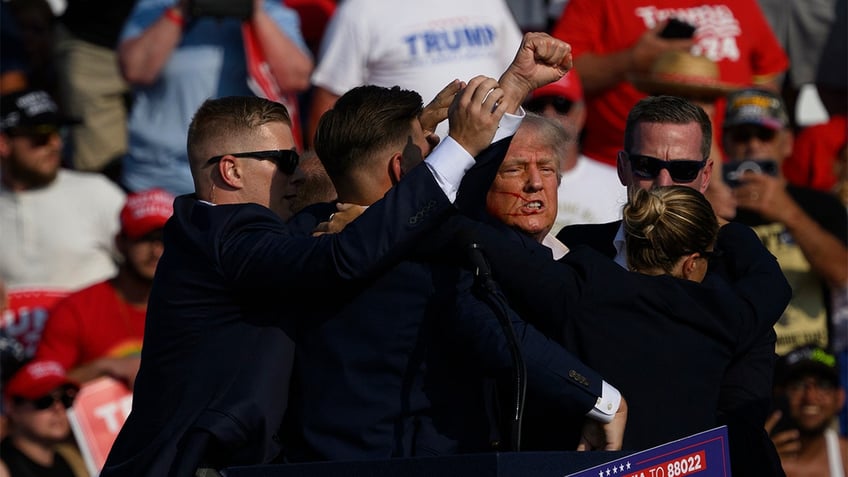 Former President Trump taken away by Secret Service after an attempted assassination.