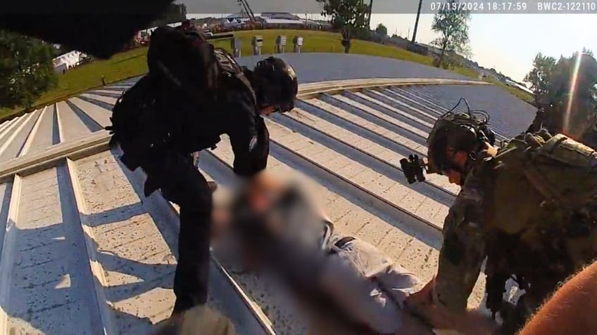 police standing over shooter thomas crooks