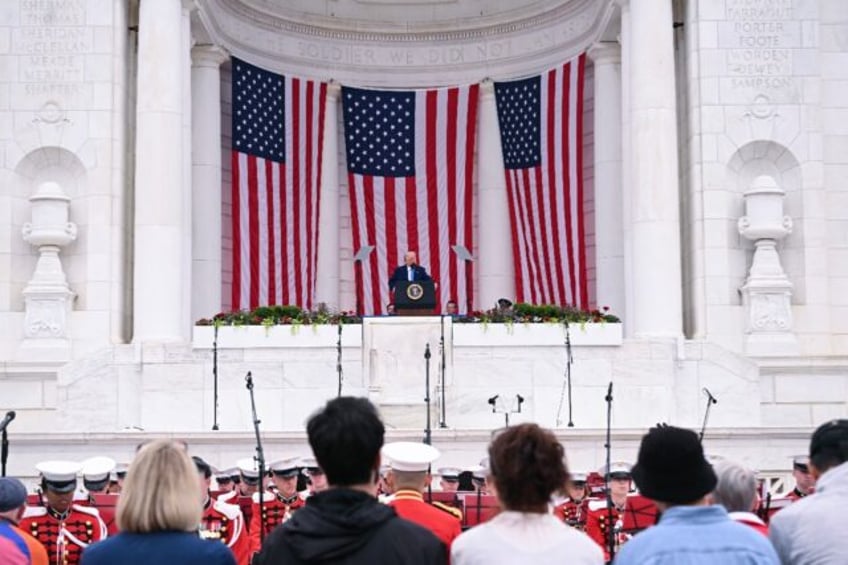 US President Donald Trump laid a wreath at Arlington National Cemetery after firing off a