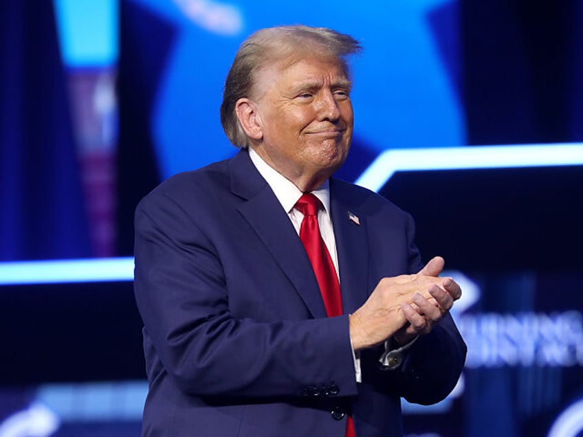 Former President of the United States Donald Trump speaking with attendees at The People's