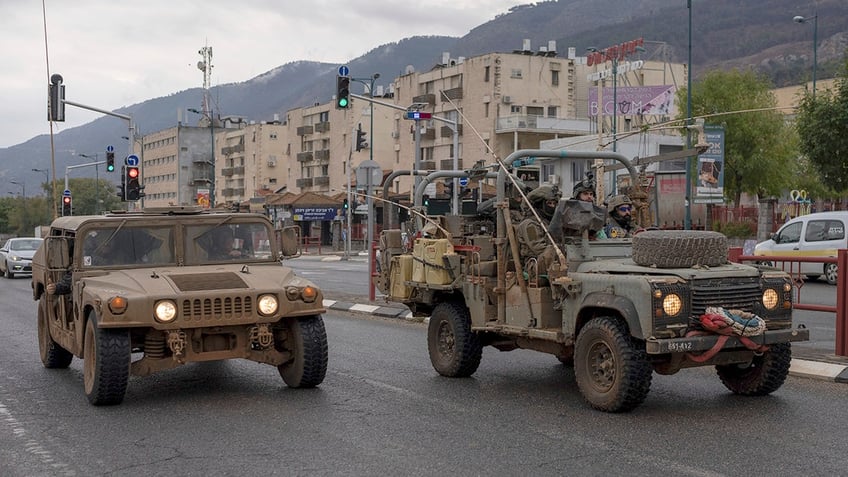 Israeli military vehicles on street in northern Israel 