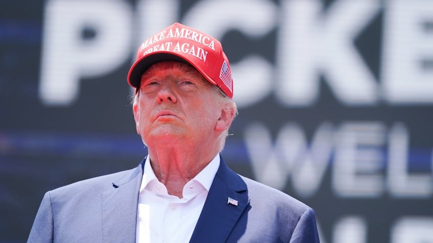 Donald Trump in red MAGA hat closeup photo
