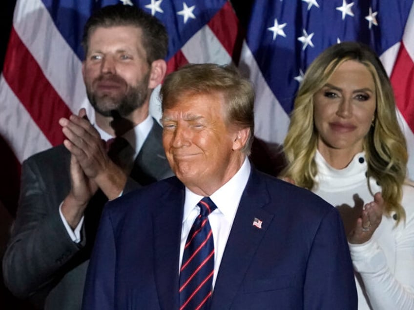 Republican presidential hopeful and former US President Donald Trump looks on, flanked by son Eric Trump (L) and daughter-in-law Lara Trump, during an Election Night Party in Nashua, New Hampshire, on January 23, 2024. Donald Trump won the key New Hampshire primary Tuesday, moving him ever closer to locking in …