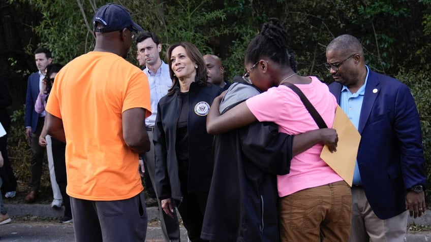 Democrat presidential nominee Vice President Harris greets people who were impacted by Hurricane Helene in Augusta, Ga., Oct. 2, 2024, as Augusta Mayor Garnett Johnson watches at right.