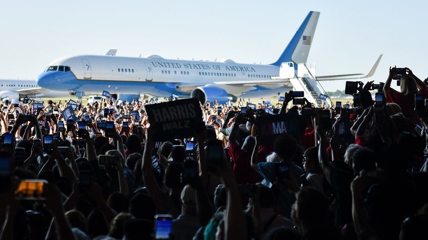 Harris supporters cheer at her arrival in Detroit