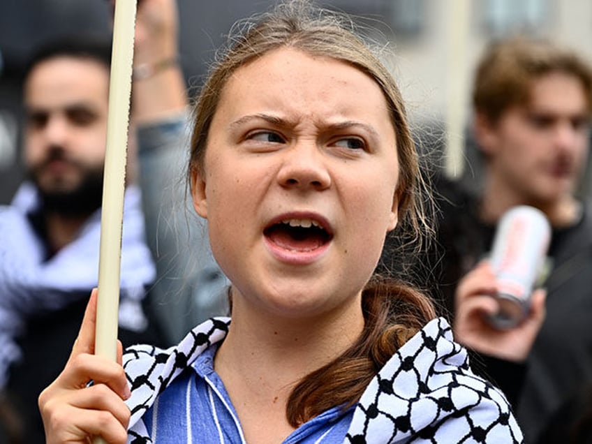 Swedish climate activist Greta Thunberg, wearing a checkered head scarf (kaffiyeh or keffi