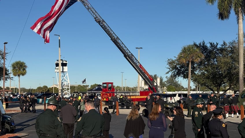 Palm Beach County deputies and others gather on Tuesday, Dec. 3, 2024, at the South Florida Fairgrounds