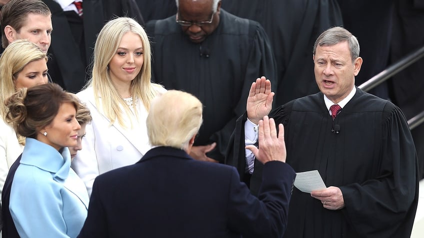 President Donald Trump takes the oath of office from Supreme Court Chief Justice John Roberts