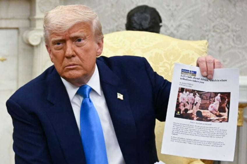 US President Donald Trump showed a sheaf of documents that he said was evidence of a 'geno