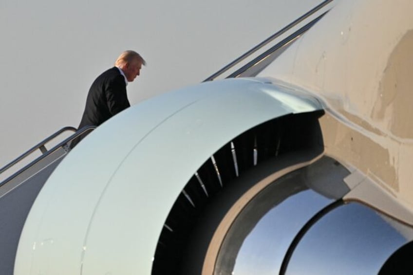 Trump boards Air Force One at Palm Beach International Airport in Florida as he returns to