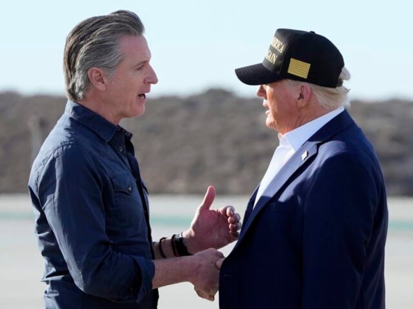 President Donald Trump talks with California Gov. Gavin Newsom after arriving on Air Force