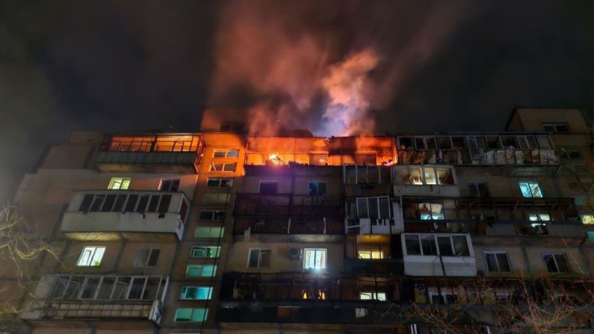 KYIV, UKRAINE - MARCH 23: Upper floors of a 9-story residential building in the Dniprovskyi district are damaged by a Russian drone strike - a fire broke out in apartments on March 23, 2025 in Kyiv, Ukraine. In the early morning, the Russian army attacked Kyiv and Oblast with Shahed-type drones, most of which were intercepted by Ukraine's Air Defense Forces. However, the fragments of some drones damaged residential high-rise buildings, an office building, and vehicles in at least five districts of the city. At least 8 people were injured; and three were killed, including a 5-year-old child. (Photo by Roman Petushkov/Global Images Ukraine via Getty Images)