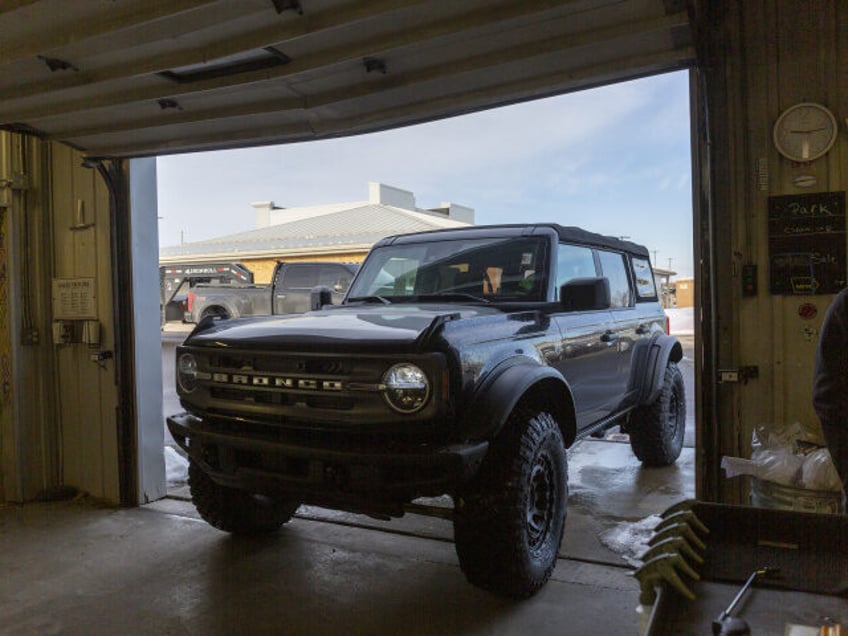A pre-sold Ford Bronco sports utility vehicle (SUV) gets detailed before shipment to a cus