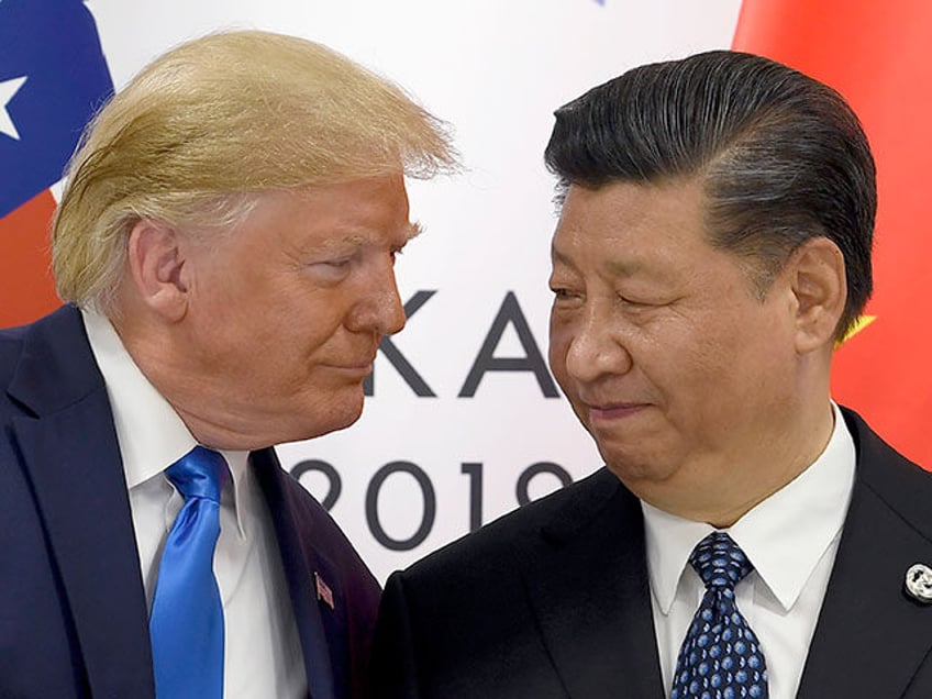 In this Saturday, June 29, 2019, file photo, U.S. President Donald Trump, left, meets with