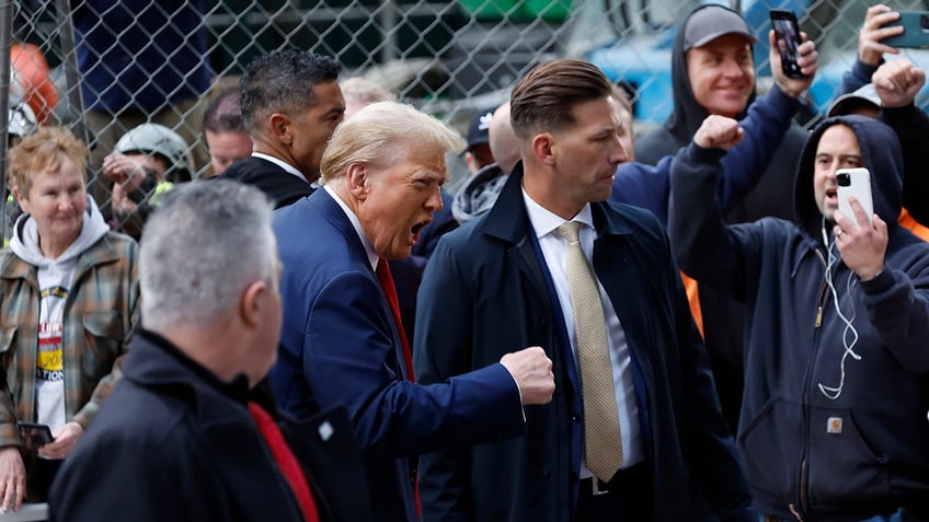 Former President Donald Trump pumps his first in NYC