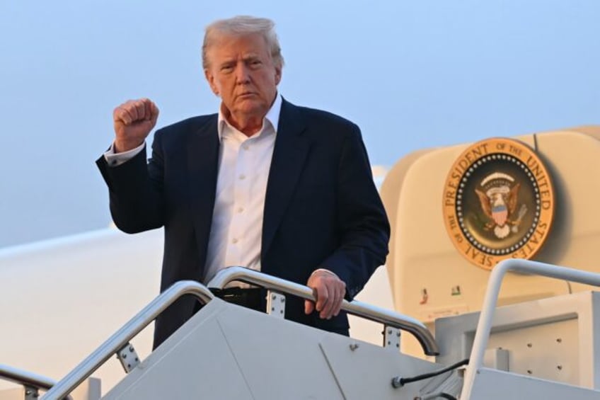 US President Donald Trump disembarks from Air Force One at Joint Base Andrews in Maryland