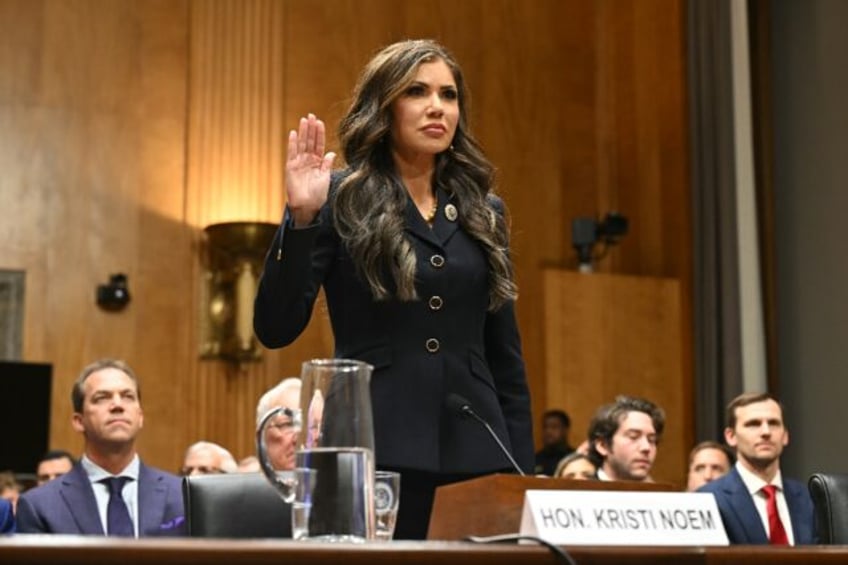 South Dakota Governor Kristi Noem is sworn in during a Senate Homeland Security and Govern