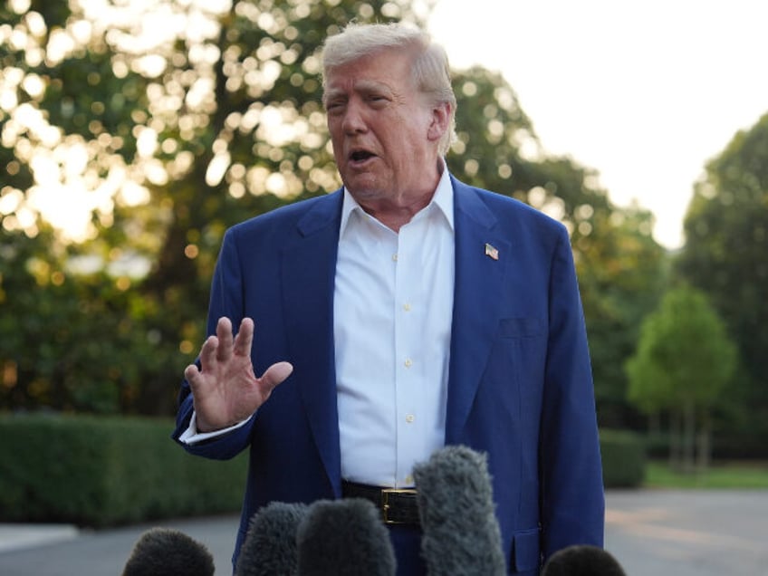 President Donald Trump speaks with reporters before boarding Marine One on the South Lawn