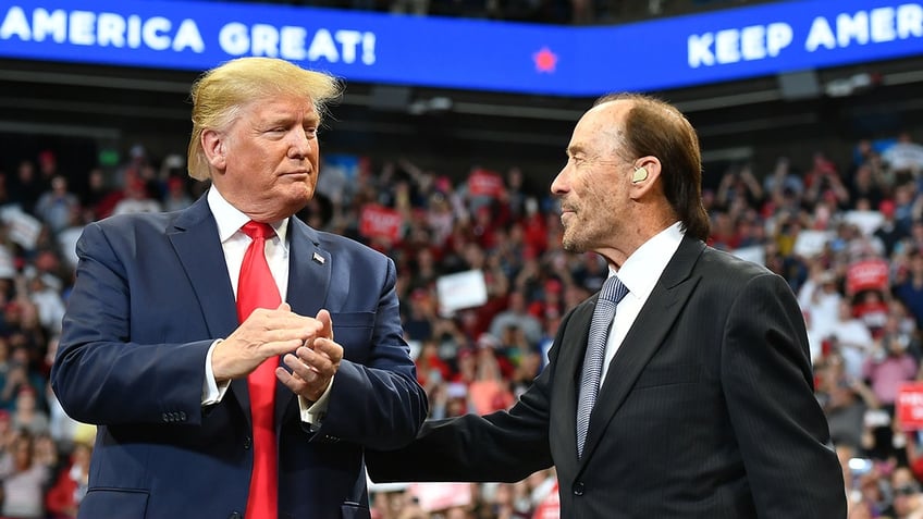 Lee Greenwood and President Trump at a rally.