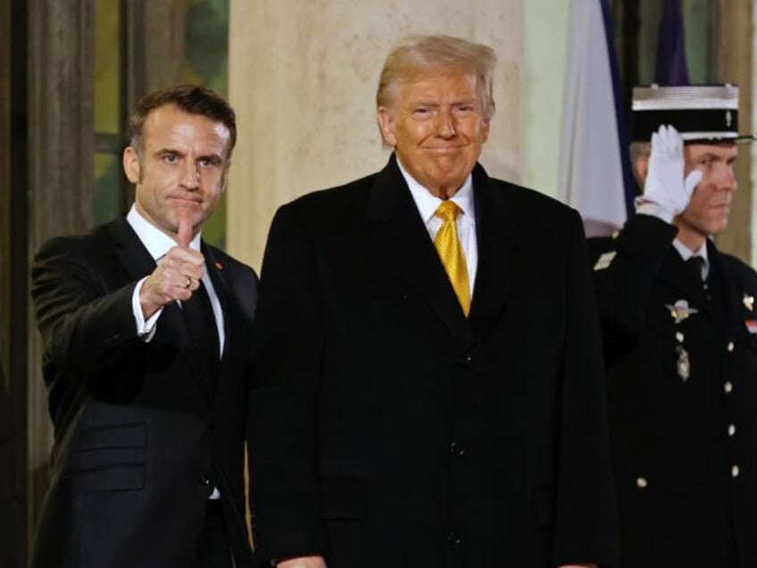 PARIS, FRANCE - DECEMBER 07: French President Emmanuel Macron (C) poses for photographers