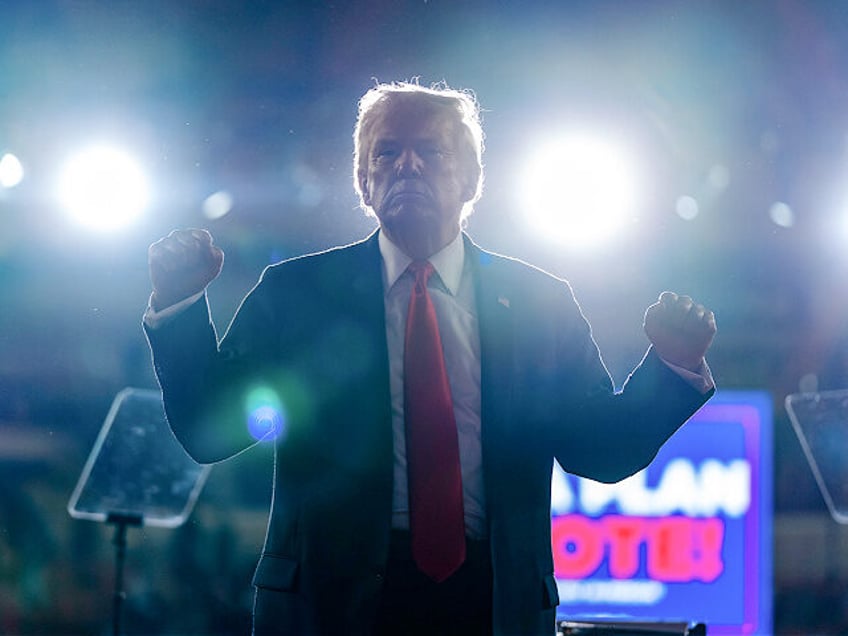 Republican presidential candidate former President Donald Trump pumps his fists after spea