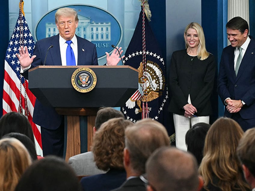 US President Donald Trump speaks alongside Attorney General Pam Bondi (2nd R) and Deputy A
