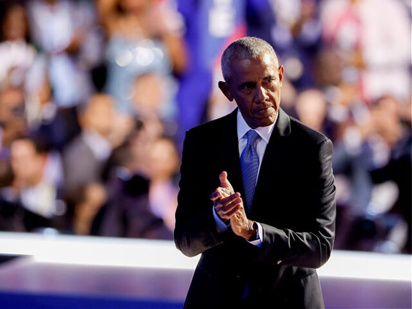 Former US President Barack Obama exits after speaking during the Democratic National Conve