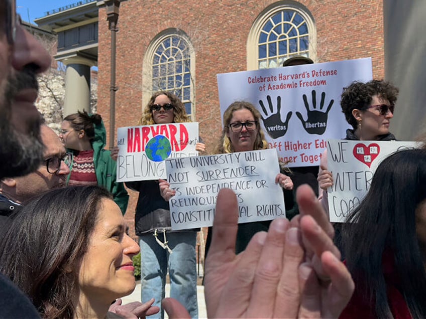 Students, faculty and members of the Harvard University community rally, Thursday, April 1