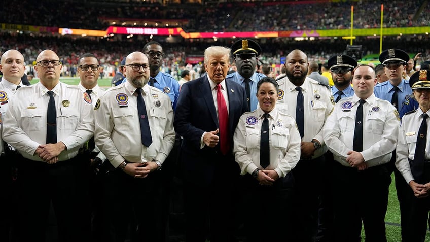 Donald Trump poses with police officers