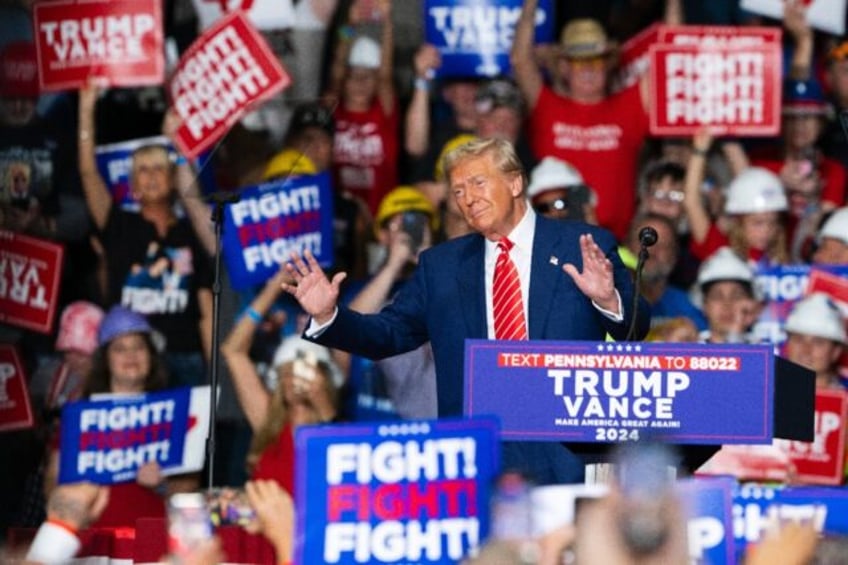 Former US president and Republican White House candidate Donald Trump speaks at a rally in