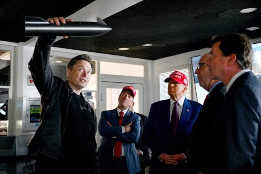 Elon Musk gives a tour to then President-elect Donald Trump and lawmakers of the control r