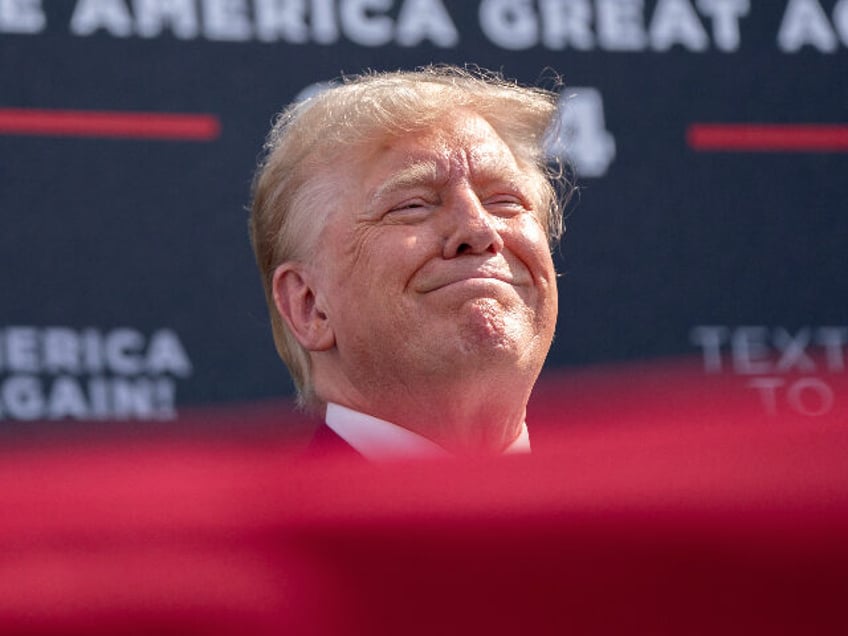 SUMMERVILLE, SOUTH CAROLINA - SEPTEMBER 25: Former President Donald Trump smiles at the cr