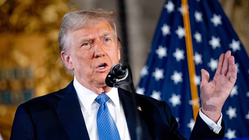 President-elect Donald Trump speaking with his hand raised