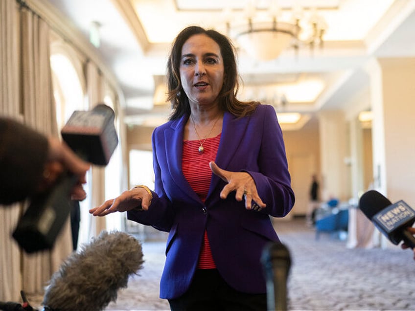 Harmeet Dhillon talks to reporters at the Republican National Committee winter meeting in