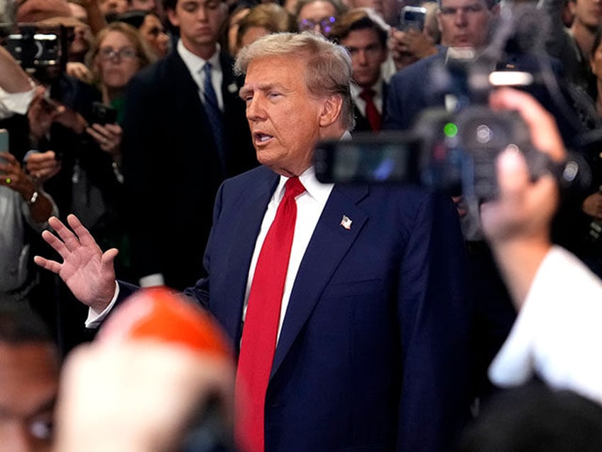 Republican presidential nominee former President Donald Trump speaks to reporters in the s