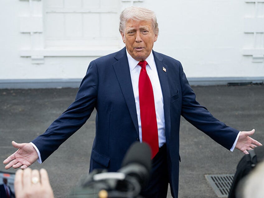 US President Donald Trump speaks with reporters outside the White House in Washington, DC,