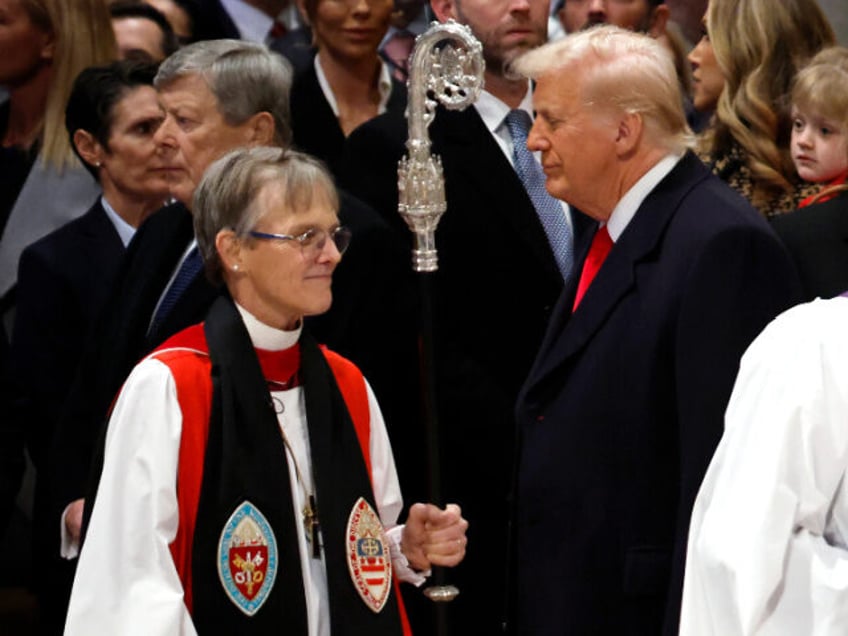 Bishop Mariann Edgar Budde (L) arrives as U.S. President Donald Trump looks on during the