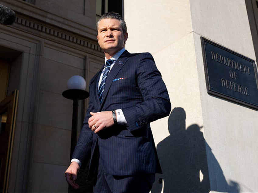 US Defense Secretary Pete Hegseth speaks with the media as he arrives on his first officia