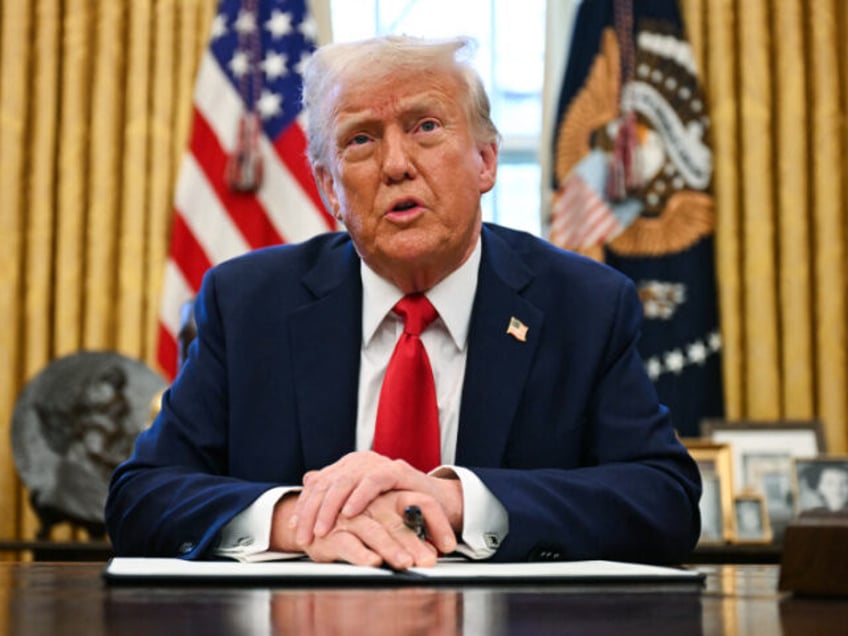 US President Donald Trump speaks to the press as he signs an executive order to create a U