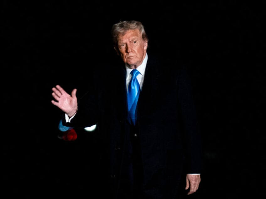 US President Donald Trump walks on the South Lawn of the White House after arriving on Mar