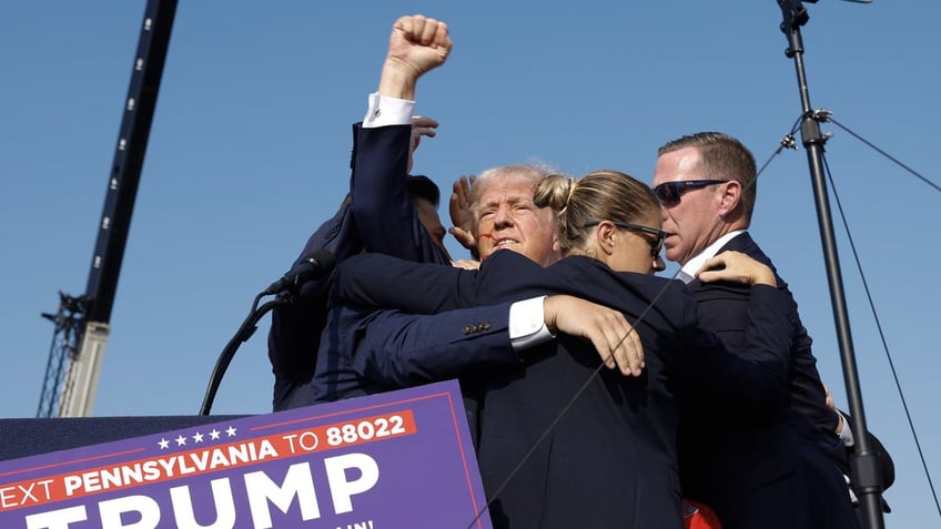 Former President Trump pumps fist after shooting