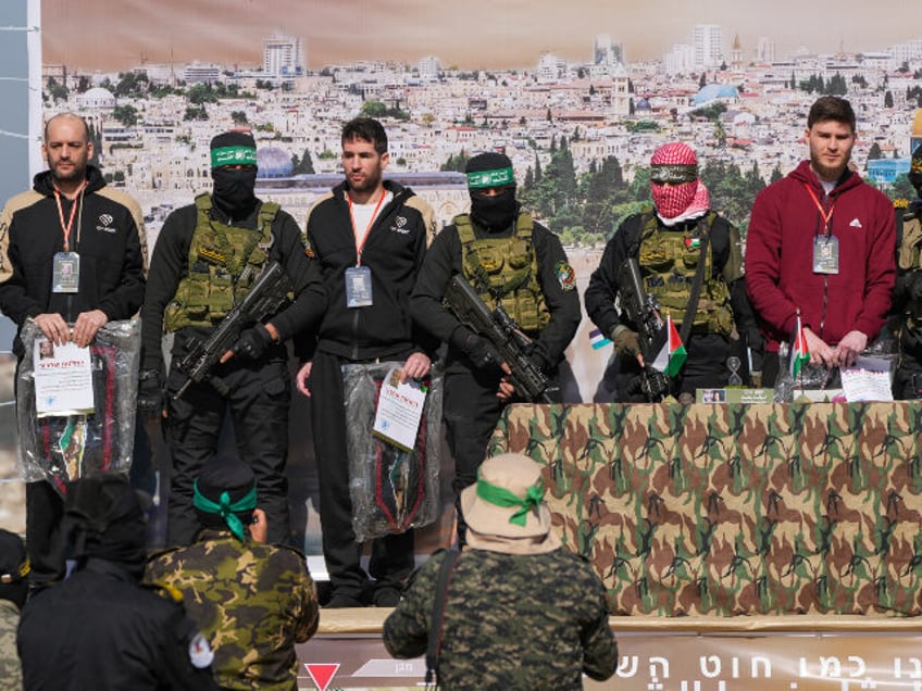 Israeli hostages Iair Horn, 46, left, Sagui Dekel Chen, 36, center left, and Alexander Tro