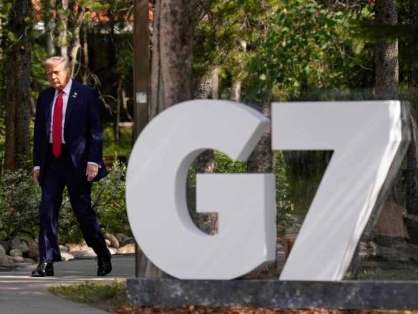 President Donald Trump arrives during the official welcome of the G7 Summit, Monday, June